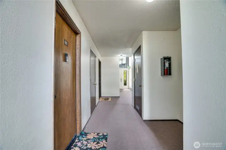 Just a few steps down the hall—look for the “hello” doormat.