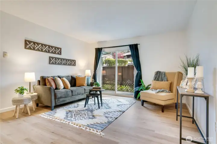 Light-filled living space with sliding doors that open to your private patio.