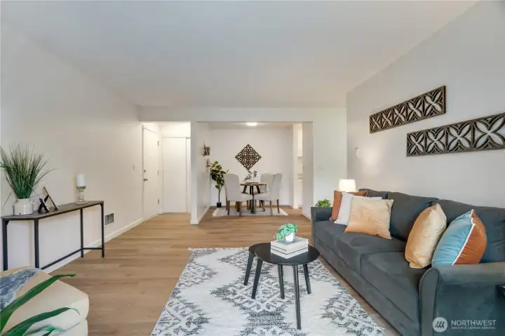 Easy flow from living to dining, with a convenient entry and coat closet nearby.