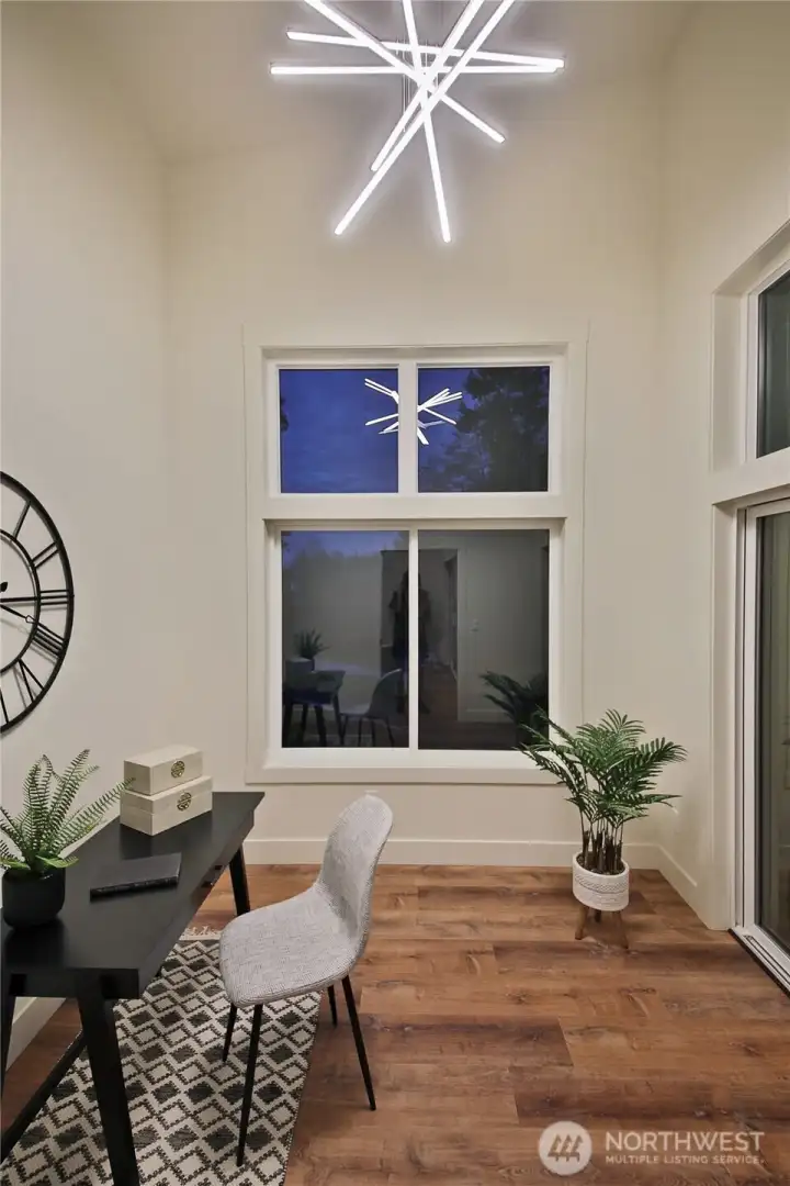 Office off the living room, also with large windows and a slider to deck.