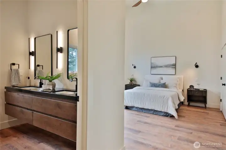 Moving to the other side of the home, into the primary bedroom.