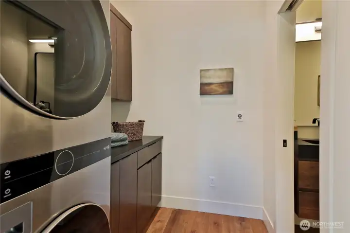 Back to the foyer, where you'll find the laundry room and 1/2 bath.