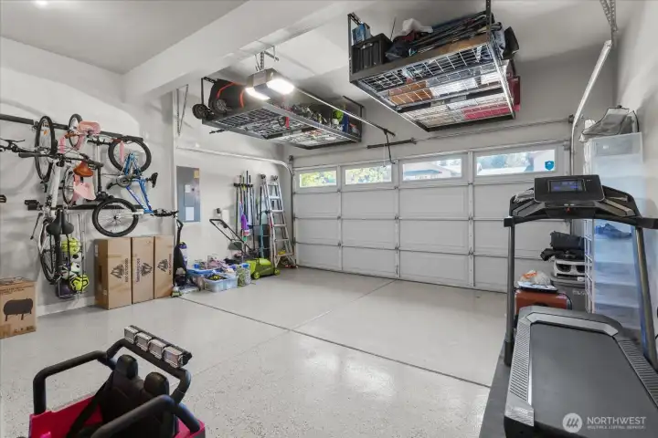 Upgraded epoxy flooring, painted and storage in garage