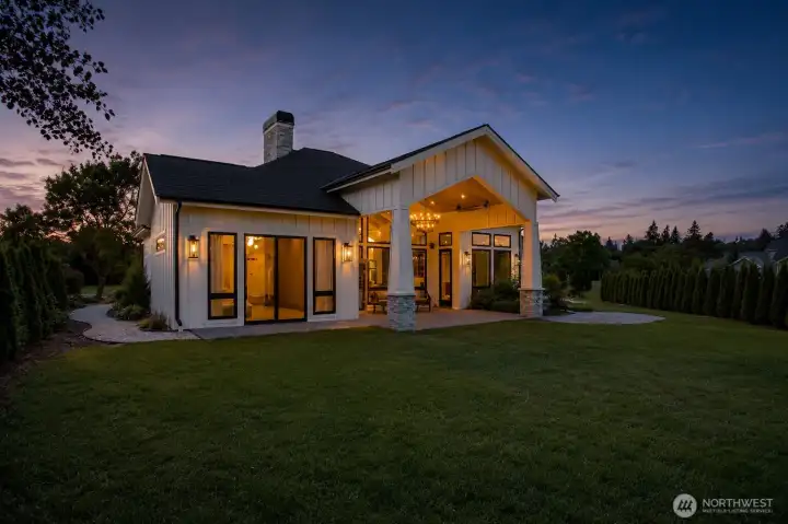 Private covered patio designed for year-round enjoyment with built-in heating and outdoor living space.