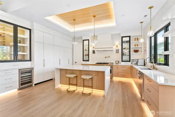 Light-filled great room and chef's kitchen , with wine cooler, and space to store wine.