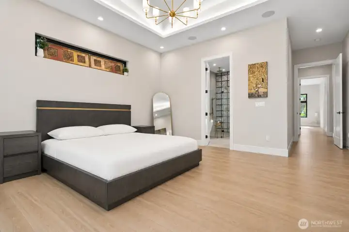Grand primary suite showcasing generous dimensions, tranquil garden views, integrated smart-home features, and effortless indoor-outdoor living.