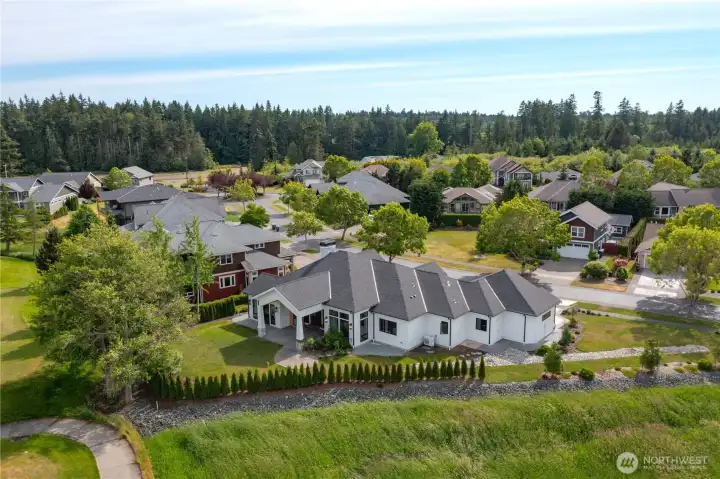 • Elevated aerial perspective highlighting the home's exceptional location within The Greens at Loomis Trail.
