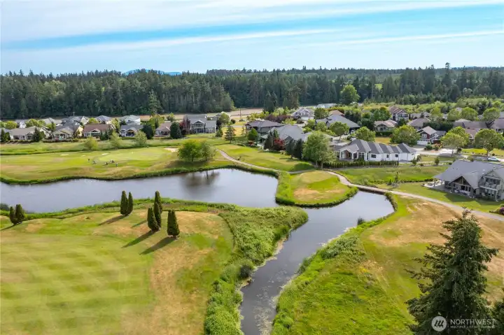 • Elevated aerial perspective highlighting the home's exceptional location within The Greens at Loomis Trail.