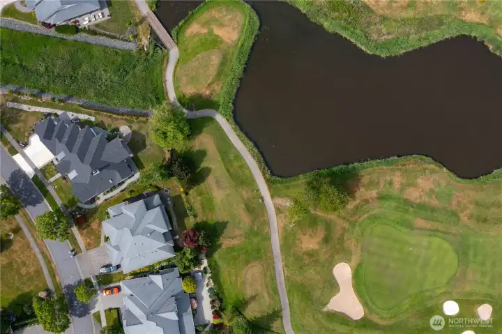 • Elevated aerial perspective highlighting the home's exceptional location within The Greens at Loomis Trail.