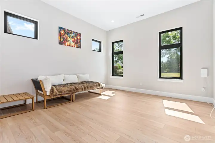 Bright secondary bedroom offering a functional layout, dedicated closet storage, and access to a shared full bath with the neighboring bedroom.