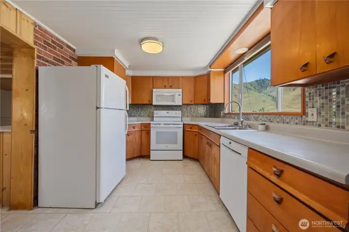 Kitchen with newly added dishwasher.