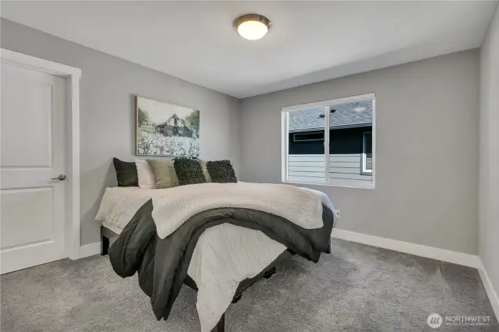 One of four upstairs bedrooms in addition to the primary, with walk-in closet One of four upstairs bedrooms in addition to the primary, with walk-in closet