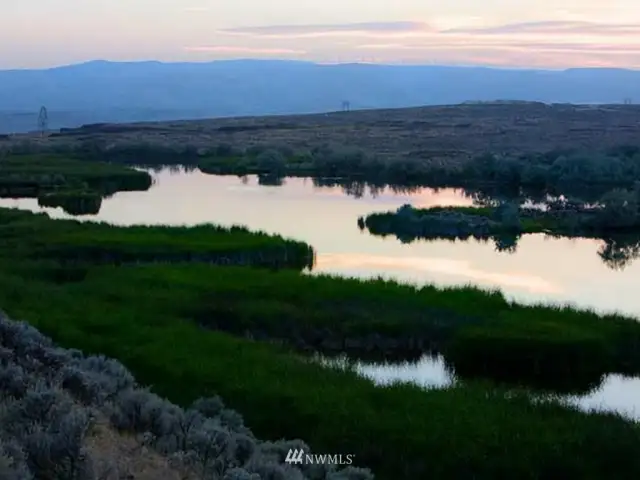 60 acres of lakes and ponds altogether:  Hilltop Lake (30 acres) spills over the 400 ft. high basalt cliff into a water fall.  Caliche Creek tumbles down alongside the Old Covered Wagon trail into the Coulee.