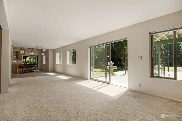 Massive "hallway" leading from the Living space into the Dining and Primary Kitchen.