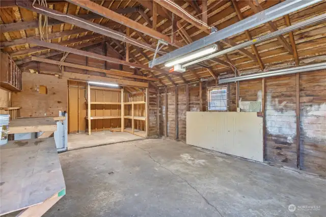 Extra deep garage w/2 man doors & electric overhead door.