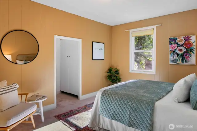 This cozy bedroom offers plenty of space for relaxation and reading.