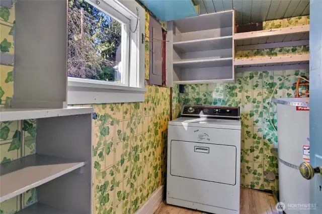 Laundry room, storage and water heater.