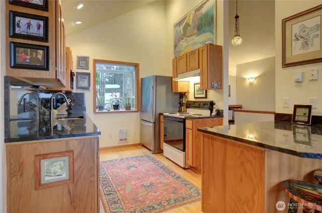 The vaulted kitchen area is perfect for a small or larger group.  It also offers a south east facing kitchen garden window to hold your herbs and house plants.