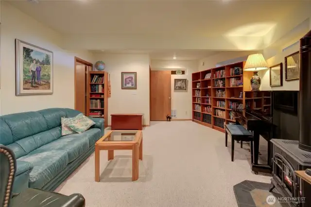 Downstairs is another living space.  You could even use it as a lock off unit if you were to rent out just the upstairs.  There is a large family room with propane stove to make it extra cozy.