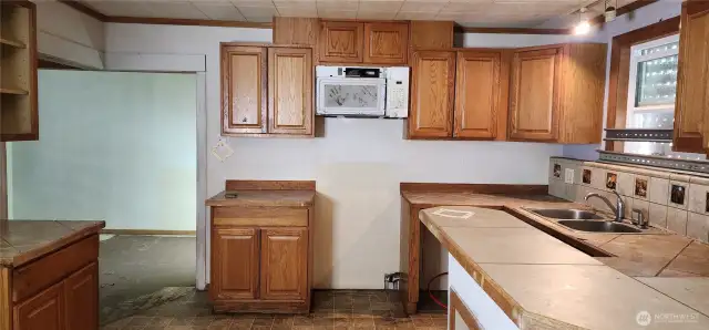 Kitchen, with dining room viewable off to the left