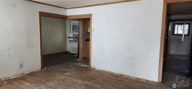 Living room, with dining room off to the left and kitchen off to the right