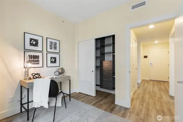 Custom closet system in guest bedroom