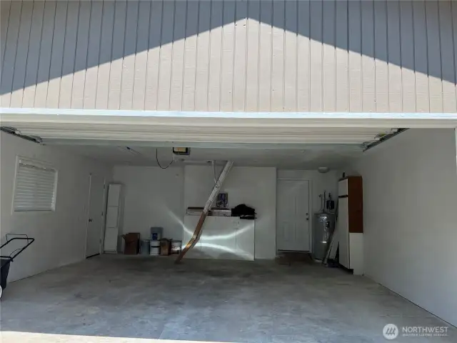 View of garage from driveway  with open door.
