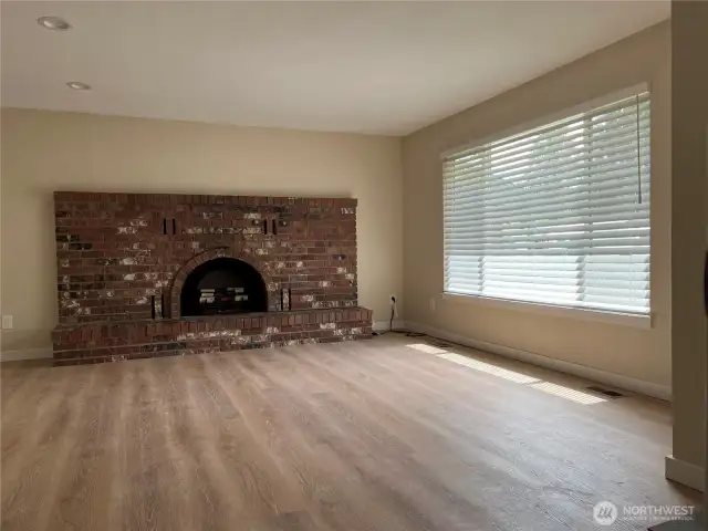 Brick fireplace with electric log insert