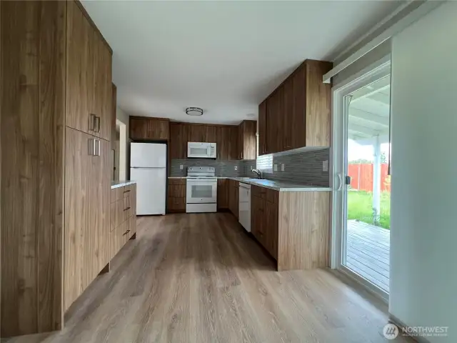 The eat-in kitchen has a sliding glass double door.