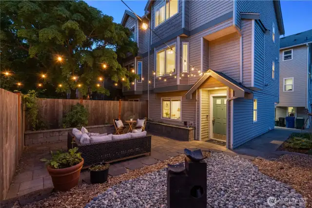 Extensive backyard updates including paver patio, stone raised garden beds, large terrace, new fence