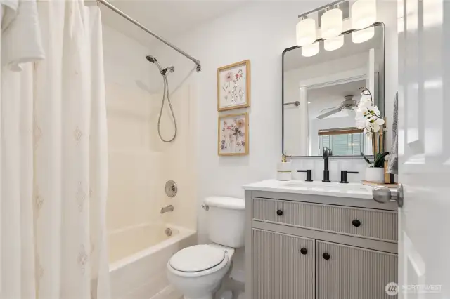En suite bath with new vanity, light, mirror, faucet, sink