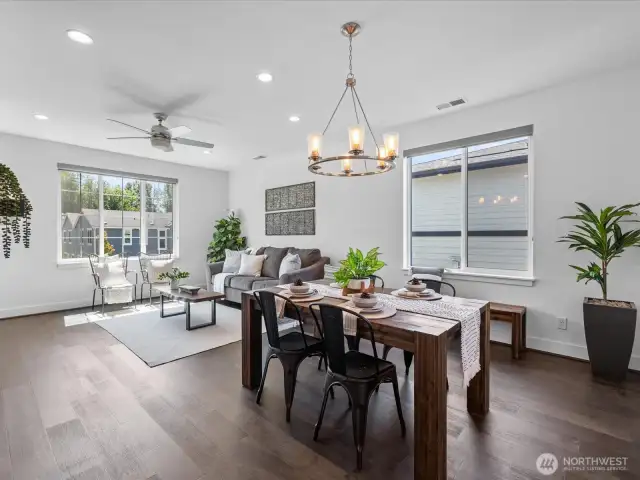 Handsome hardwoods, walls of windows, custom blinds greet you!