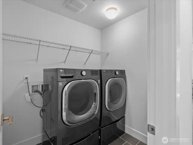 Laundry room with wonderful pedestal washer/dryer located off teh hallway between the bedrooms.