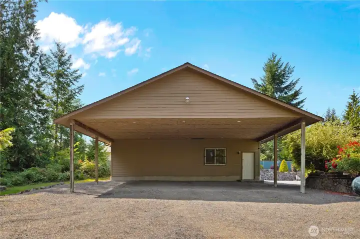 Huge carport for all of your toys or extra car parking