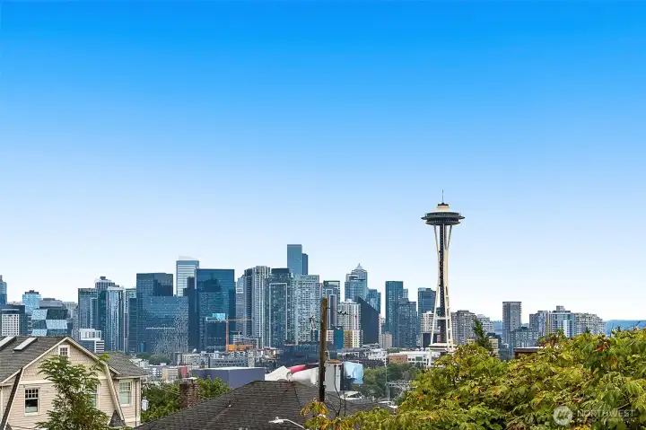 Morning coffee with the Space Needle, evening sunsets with the city lights.