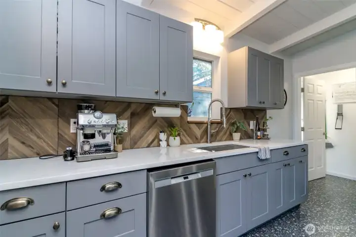 New cabinet hardware compliments the stainless steel appliances.