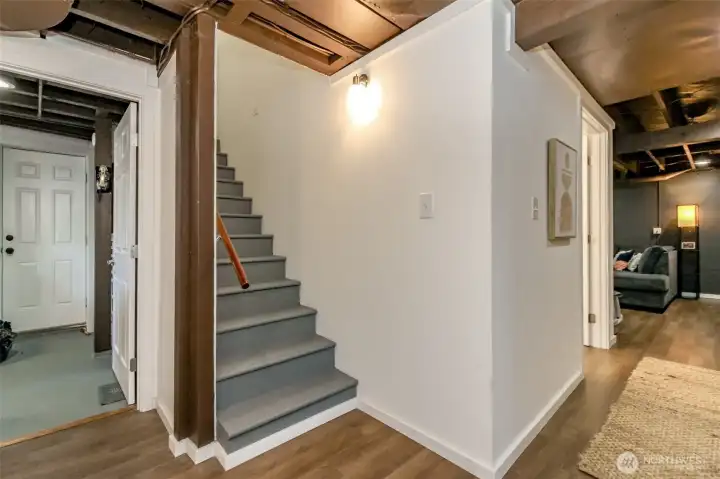Stairs from the kitchen lead to the fully-finished basement.