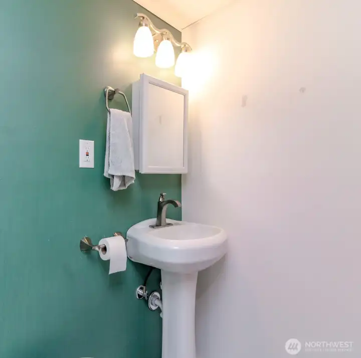 3/4 bathroom downstairs next to the third bedroom.