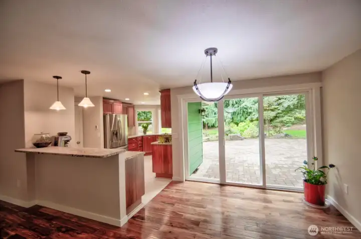 Dining area off kitchen with slider to back patio.