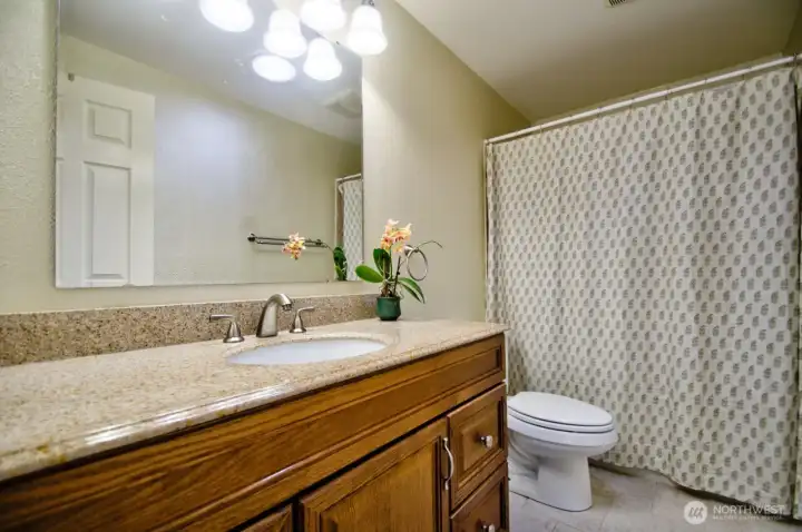 Main full bath with heated tile flooring