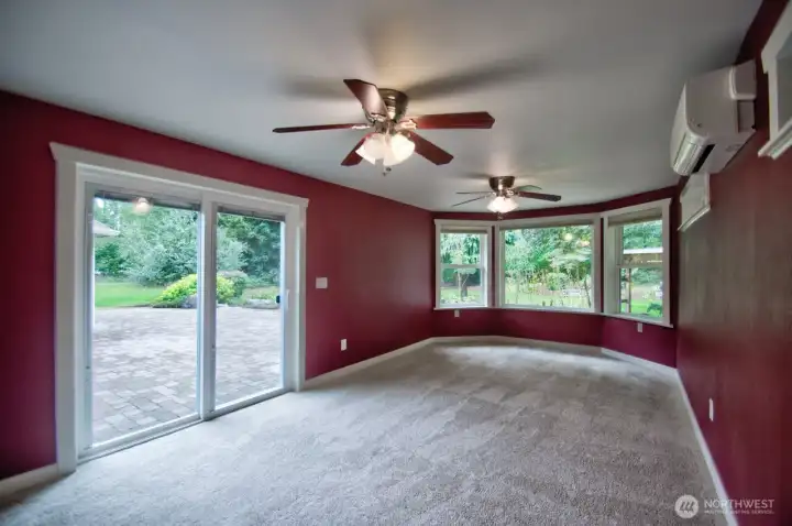 Primary suite that offers large living space and double fans with slider to patio and backyard.