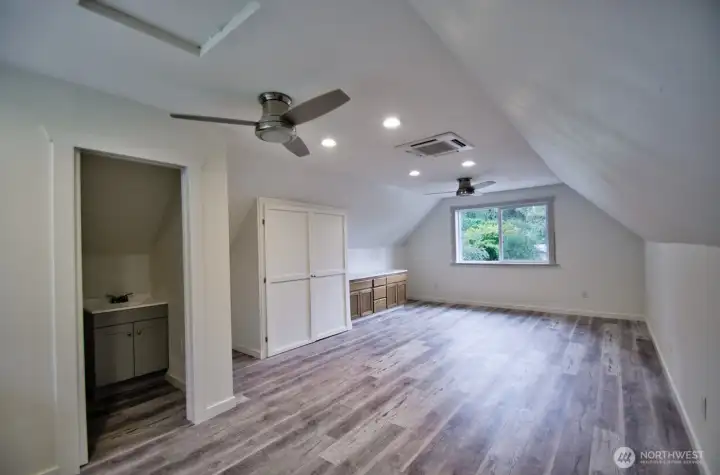 Bonus room over the garage that offers 1/2 bath with lots of uses for this space!