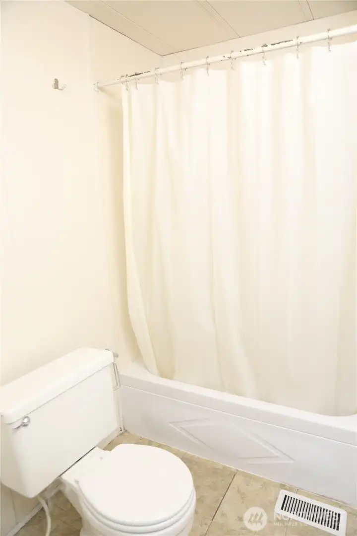 The main bedroom ensuite includes a full bathroom complete with ample storage for convenience and organization. (storage is not seen in this picture.)