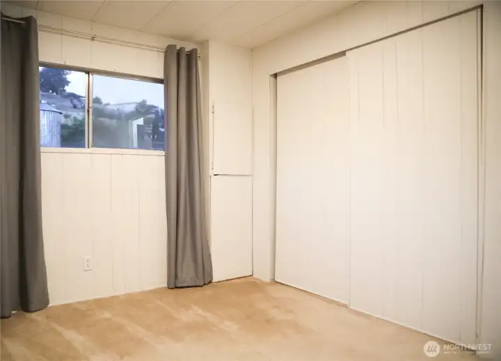 Another view of the second bedroom with a spacious closet for ample storage.
