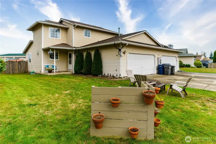 Large side yard with fenced backyard. The over sized 2-car garage has great storage!