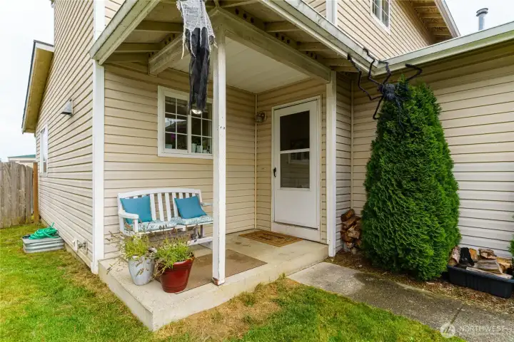 Front porch for relaxing, having coffee or container gardening.