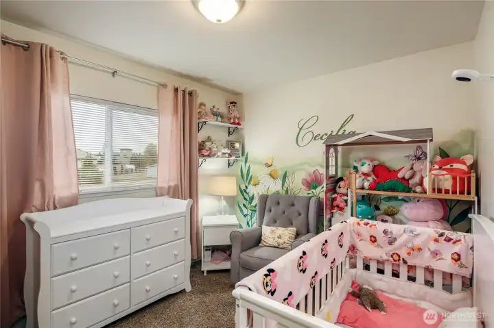 One of the two bedrooms upstairs has a painted mural that is absolutely beautiful. Very light & bright room.