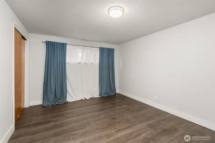 The lower level 4th bedroom. Along with the lower level 3/4 bath and large rec room, this offers a perfect option for guests - short or long term - or, use it as your hobby space... so much flexibility!