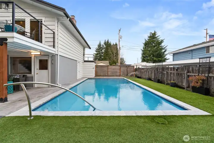 This gorgous pool was resurfaced and re-tiled in 2019, and old decking was replaced with turf at that time. It has a new pump (2025) and directly behind the photographer is a fun, stylish tiled outdoor shower!