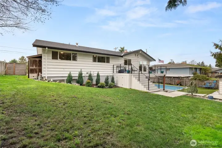 A look back toward your newly updated mid-century paradise. At the left end of the home you'll find two additional sheds for even more storage. Wouldn't you just love to make this home yours?